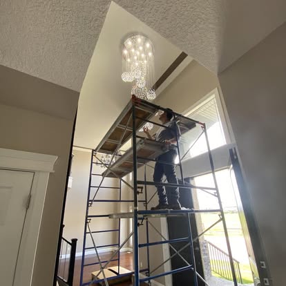 Crystal pendant fixture install in high foyer