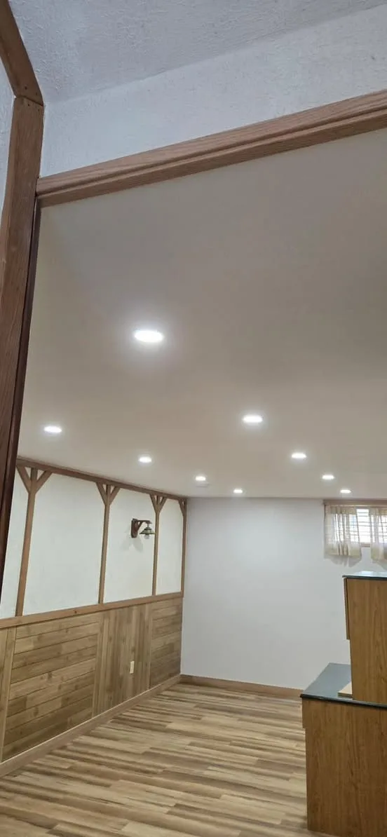 Basement renovation with an evenly spaced recessed pot light layout